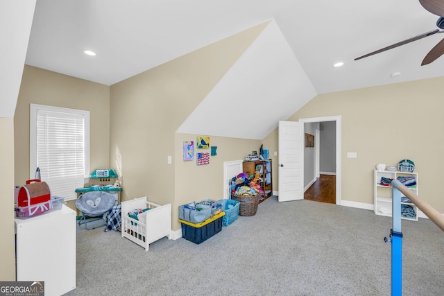 game room featuring vaulted ceiling, hardwood / wood-style flooring, and ceiling fan