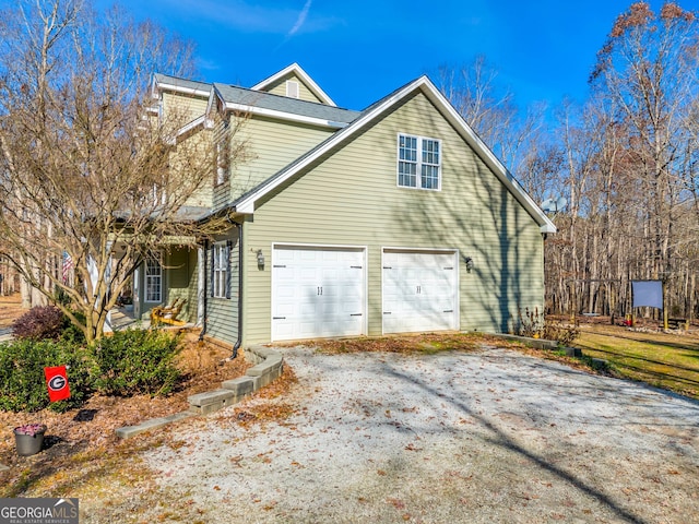 view of side of property with a garage