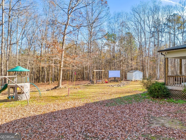 view of yard featuring a shed and a playground