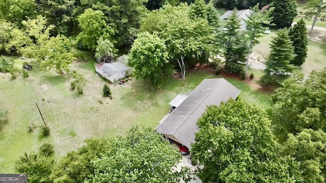 birds eye view of property with a rural view