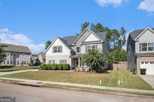 view of front of home featuring a garage and a front yard