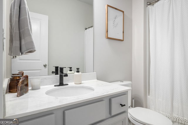 full bathroom with vanity and toilet