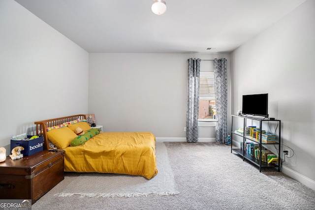 bedroom with carpet floors, baseboards, and visible vents