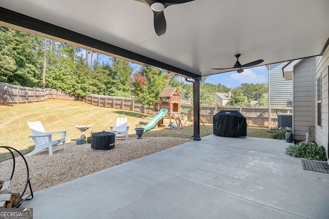 view of patio with ceiling fan, a playground, a fenced backyard, and a grill