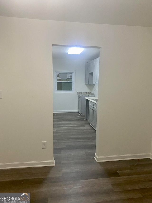 hall with dark hardwood / wood-style flooring