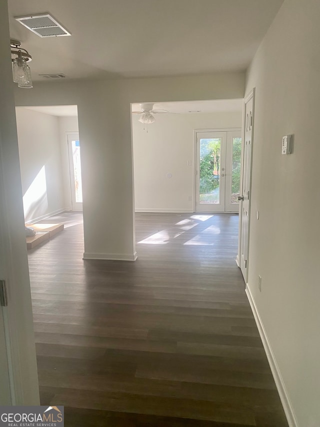 hallway featuring dark hardwood / wood-style floors