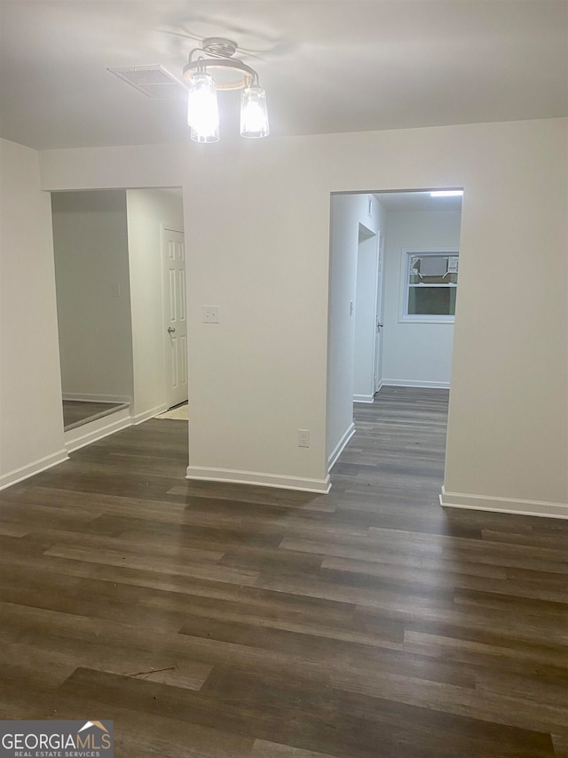 empty room featuring dark wood-type flooring