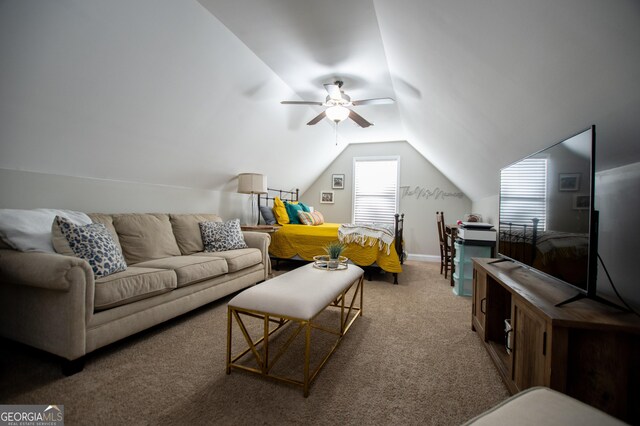 carpeted living room featuring ceiling fan and vaulted ceiling