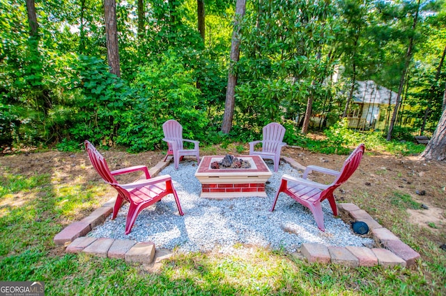 view of patio / terrace featuring an outdoor fire pit