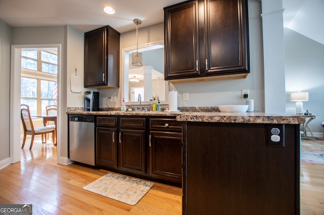 kitchen featuring dishwasher, decorative light fixtures, light wood-type flooring, and dark brown cabinetry