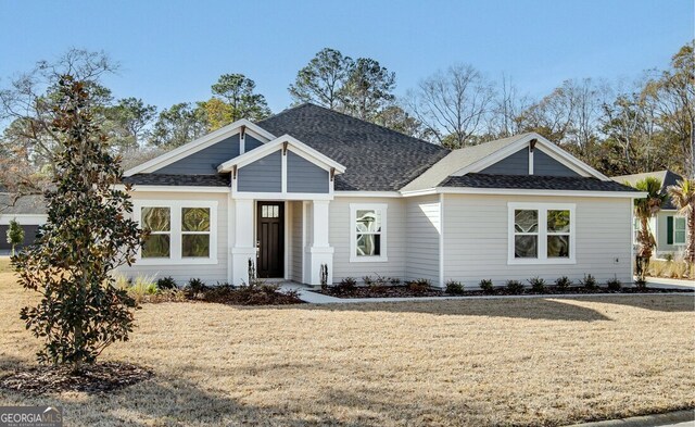 view of front of home featuring a front yard