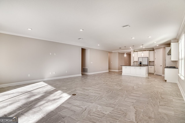 unfurnished living room with crown molding