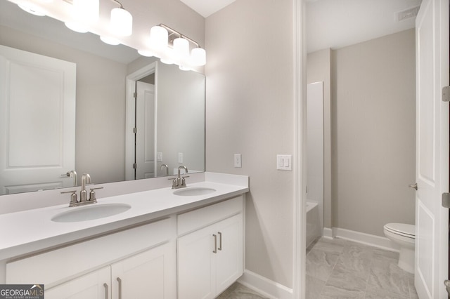 bathroom with vanity and toilet