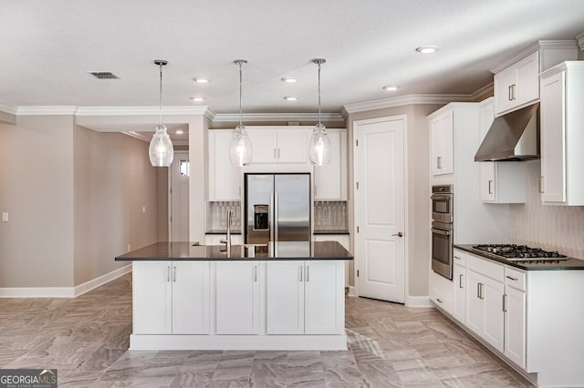 kitchen with a center island with sink, exhaust hood, appliances with stainless steel finishes, and decorative light fixtures