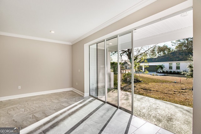 spare room featuring ornamental molding