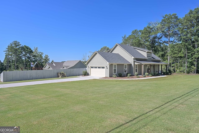 view of front of home with a garage and a front lawn