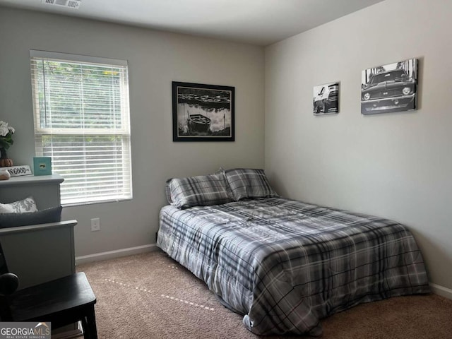 bedroom featuring carpet