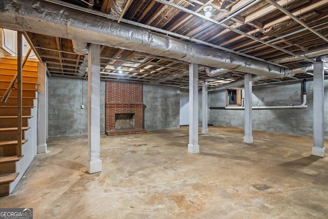 basement with a brick fireplace