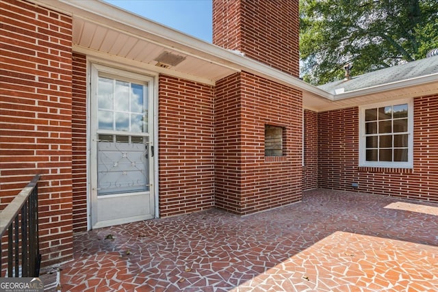 entrance to property featuring a patio