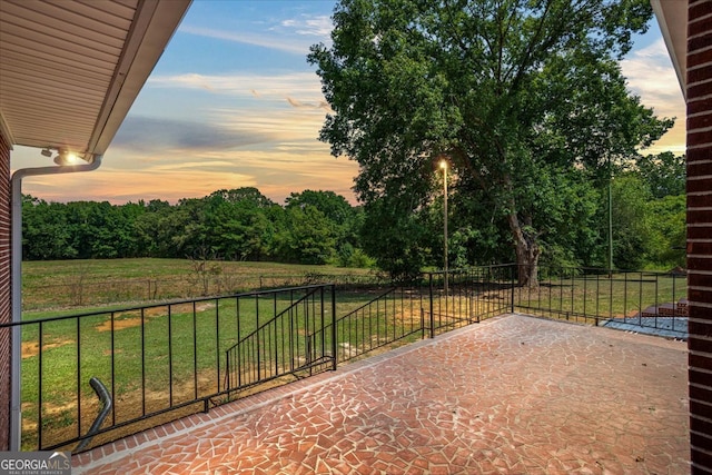 patio terrace at dusk with a lawn