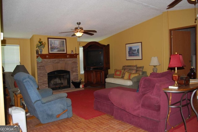 living room featuring a fireplace, parquet floors, a textured ceiling, ceiling fan, and lofted ceiling