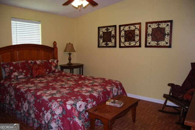 bedroom featuring lofted ceiling, ceiling fan, dark parquet floors, and a textured ceiling