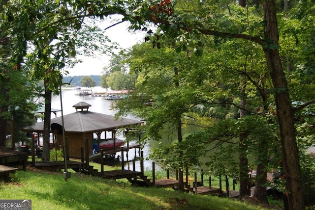 view of dock featuring a water view and boat lift