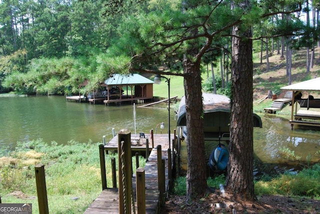 dock area featuring a water view and boat lift