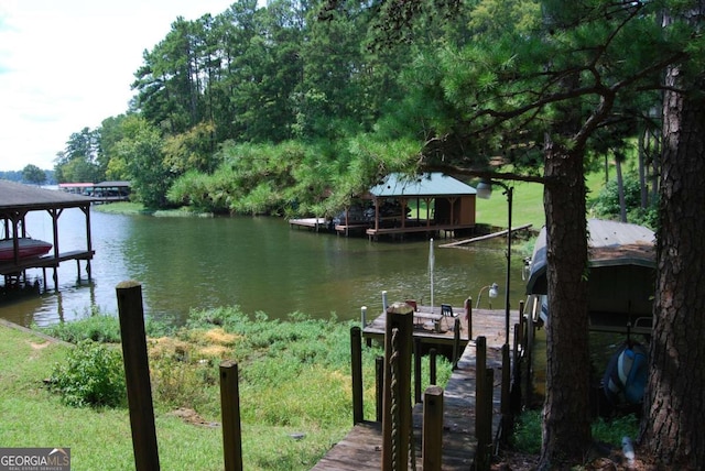 view of dock with a water view and boat lift