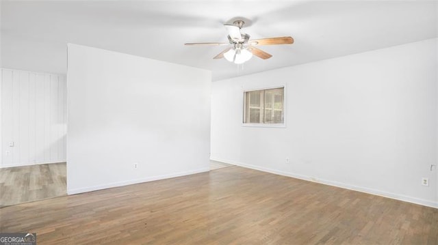 spare room featuring ceiling fan and light hardwood / wood-style floors