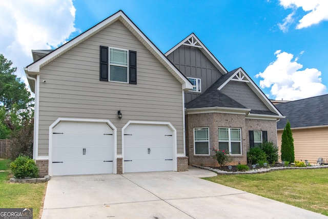 view of front facade with a garage and a front yard