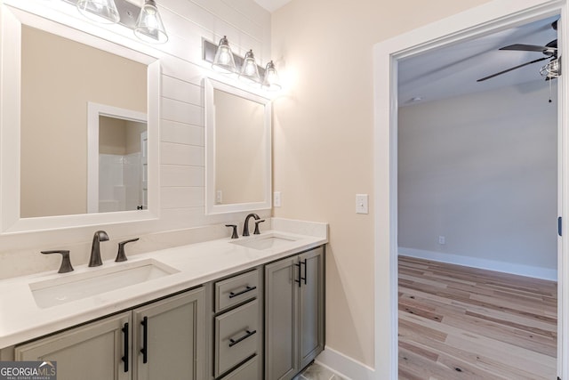 bathroom featuring vanity, wood-type flooring, and ceiling fan