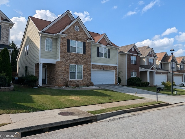 view of front of home featuring a front yard and a garage