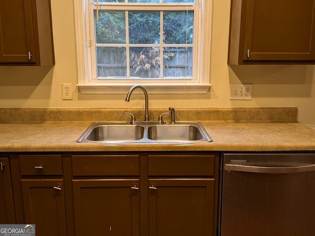 kitchen featuring stainless steel dishwasher and sink