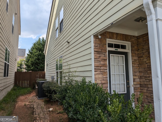 view of side of home with cooling unit