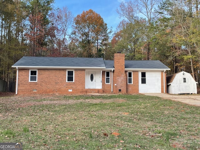 single story home with a front lawn and a storage unit