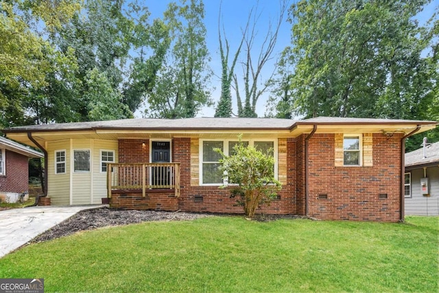 ranch-style house featuring covered porch, brick siding, crawl space, and a front yard