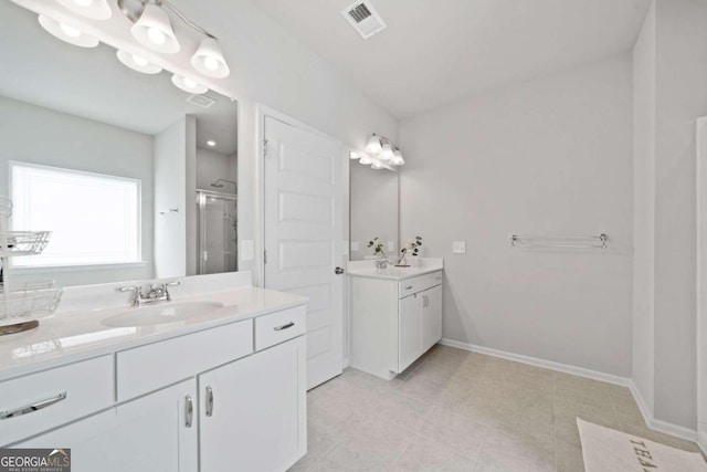 bathroom with walk in shower and vanity