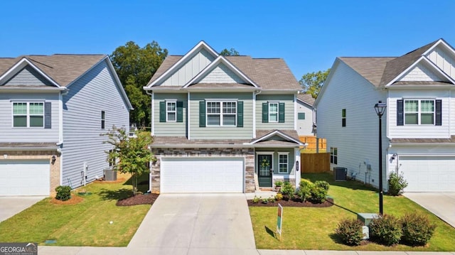 craftsman-style house with a garage, central AC unit, and a front yard