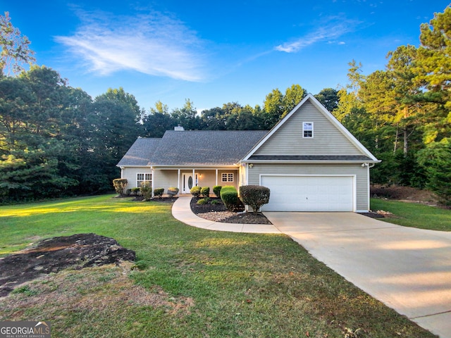 view of front of property featuring a garage and a front lawn