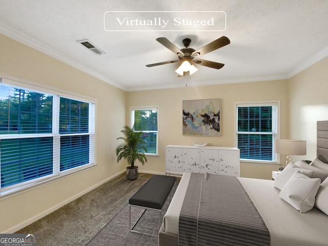 bedroom featuring crown molding, ceiling fan, and carpet floors