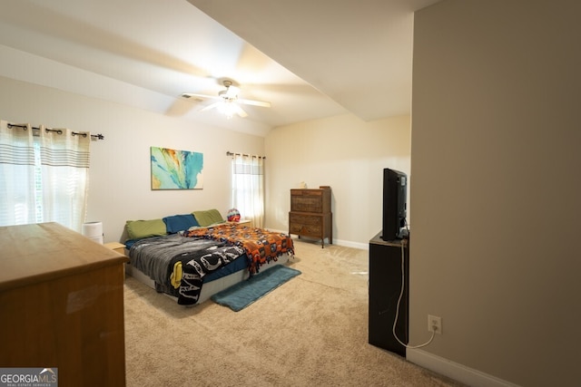 bedroom with light colored carpet and ceiling fan