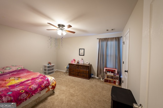 bedroom with light colored carpet and ceiling fan