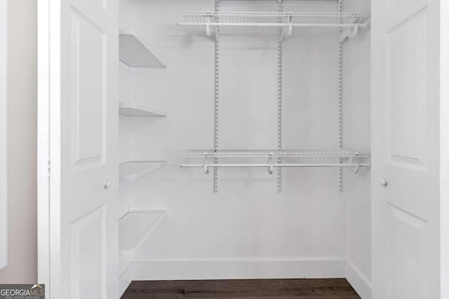 walk in closet featuring hardwood / wood-style floors