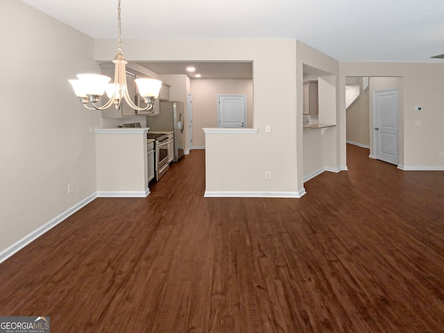 kitchen featuring an inviting chandelier, dark hardwood / wood-style flooring, stainless steel range with gas cooktop, and decorative light fixtures