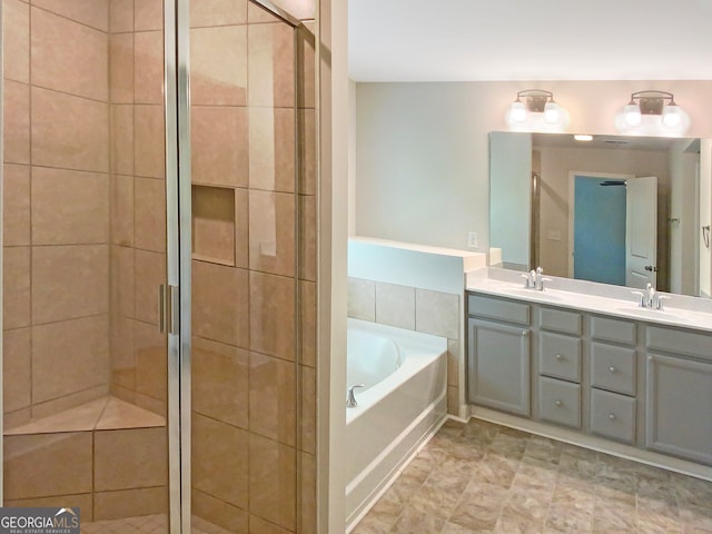 bathroom with plus walk in shower, tile patterned flooring, and vanity