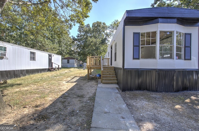 view of yard with stairway and a wooden deck