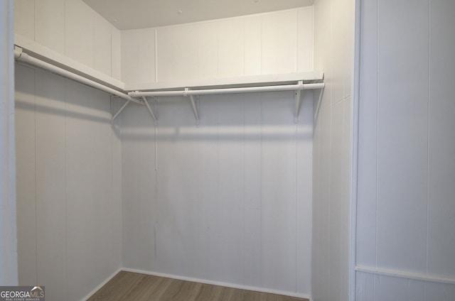 spacious closet featuring wood finished floors