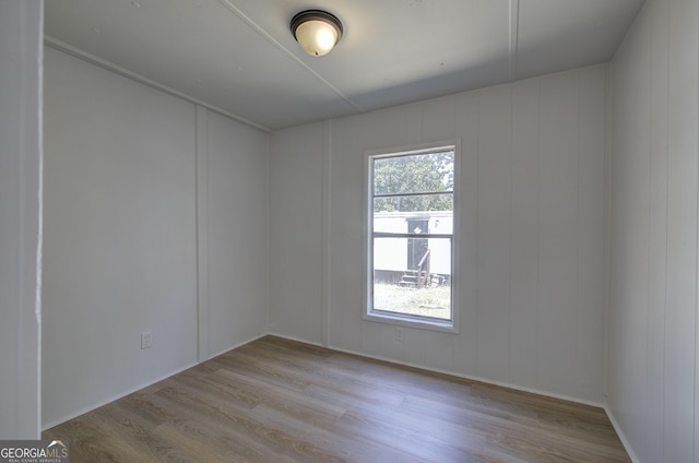 empty room with wood finished floors