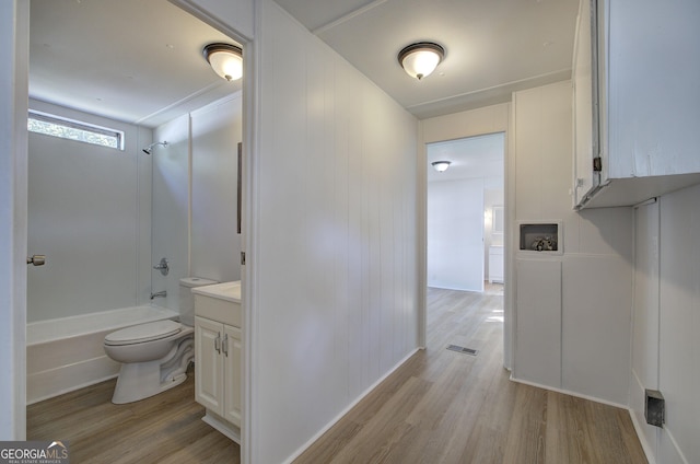 full bathroom featuring visible vents, toilet, wood finished floors, and vanity